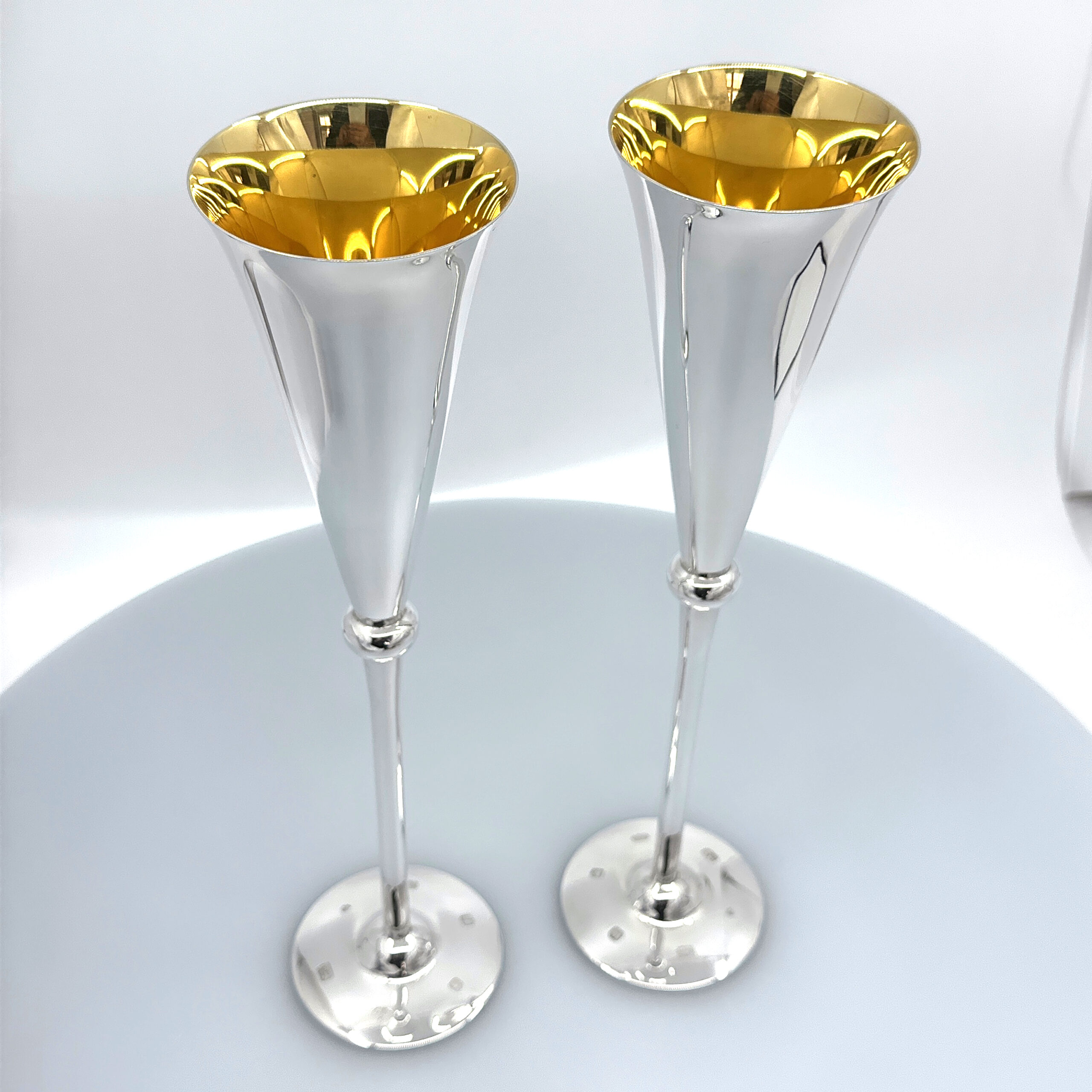 BOX27 (7) Pair Of Champagne Flutes With Gilded Interior, finished in 925 English Hallmarked Sterling Silver
