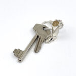 Riding Boot And Crop Keyring With Twist Link Fastening Finished In 925 English Hallmarked Sterling Silver