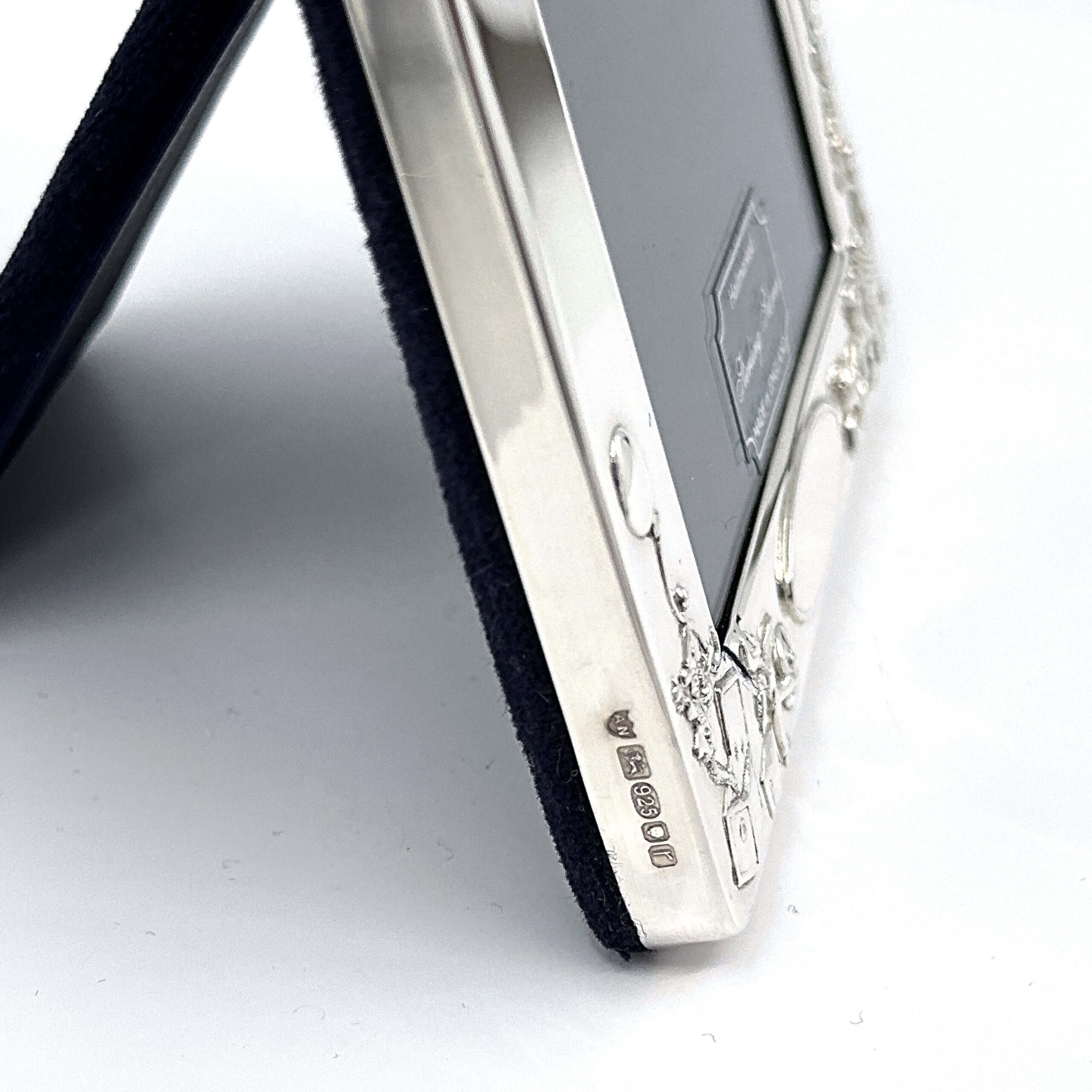 FR534 (7) Baby Photo Frame With Toy Motif Border And Blue Velvet Back Finished In 925 English Hallmarked Sterling Silver