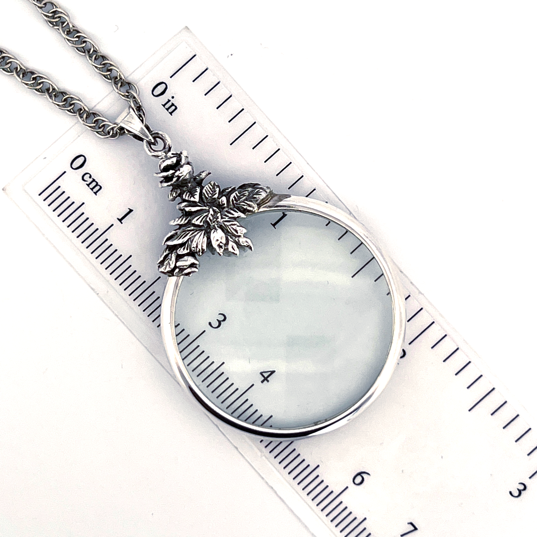 PT221 (1) Floral Magnifying Glass Pendant On Chain, Finished In 925 English Hallmarked Sterling Silver
