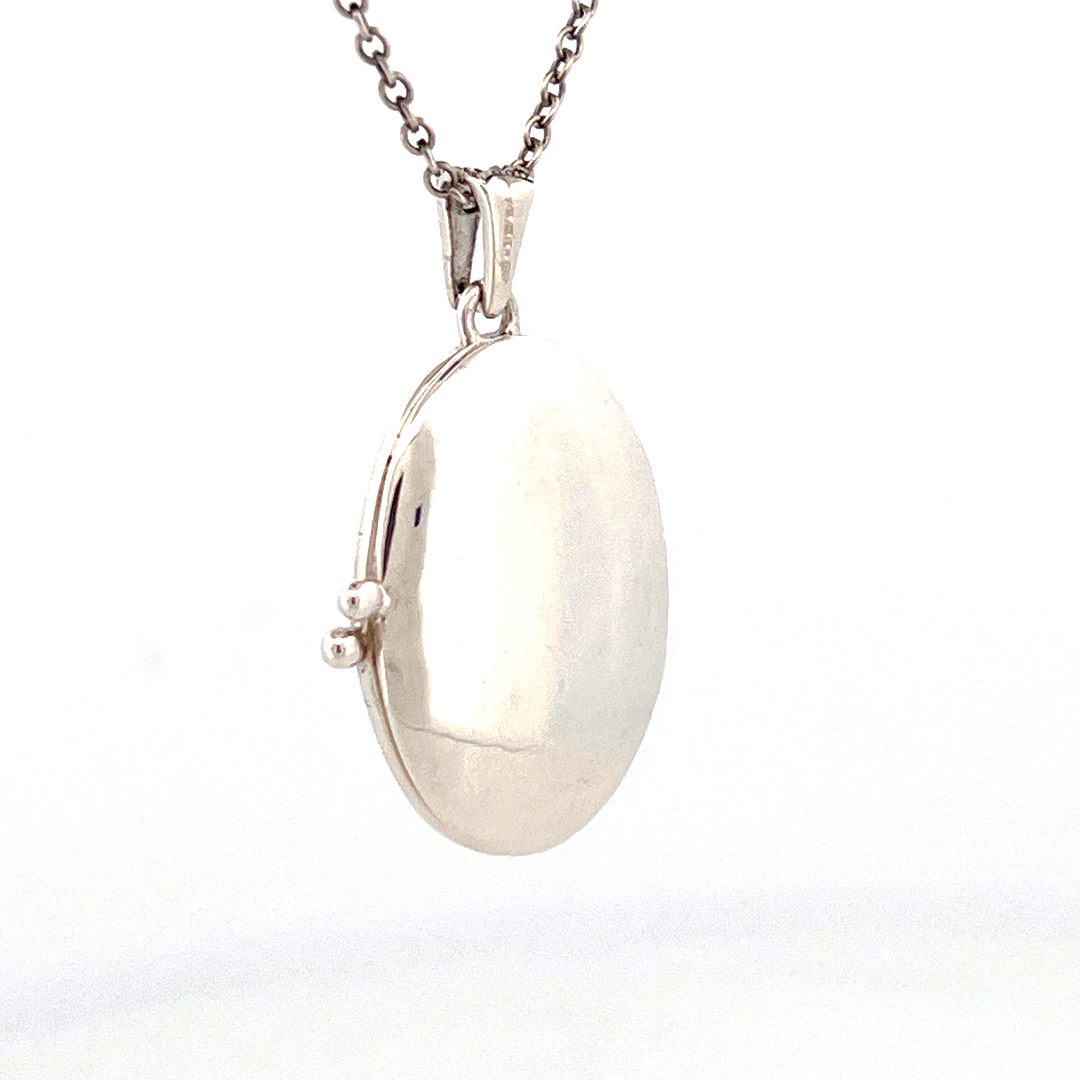 PT276 (8) Oval Locket Set With Garnet And Marcasite, Finished In 925 English Hallmarked Sterling Silver