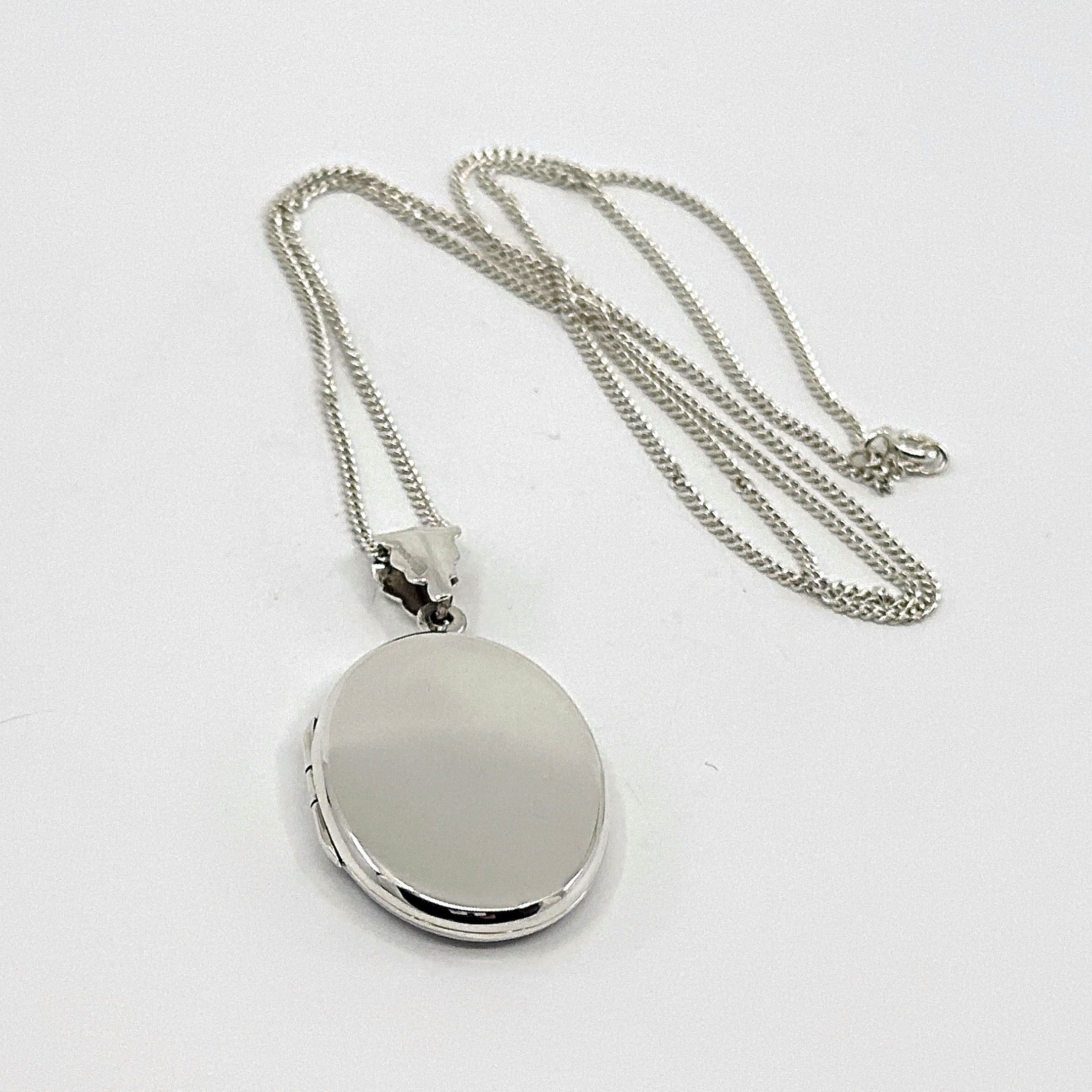 PT466 (3) Oval Locket On Curb Chain, Finished In 925 English Hallmarked Sterling Silver