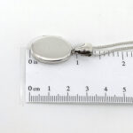 Small Oval Locket On Curb Chain, Finished In 925 English Hallmarked Sterling Silver 3 Small Oval Locket On Curb Chain, Finished In 925 English Hallmarked Sterling Silver