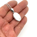 Small Oval Locket On Curb Chain, Finished In 925 English Hallmarked Sterling Silver 4 Small Oval Locket On Curb Chain, Finished In 925 English Hallmarked Sterling Silver