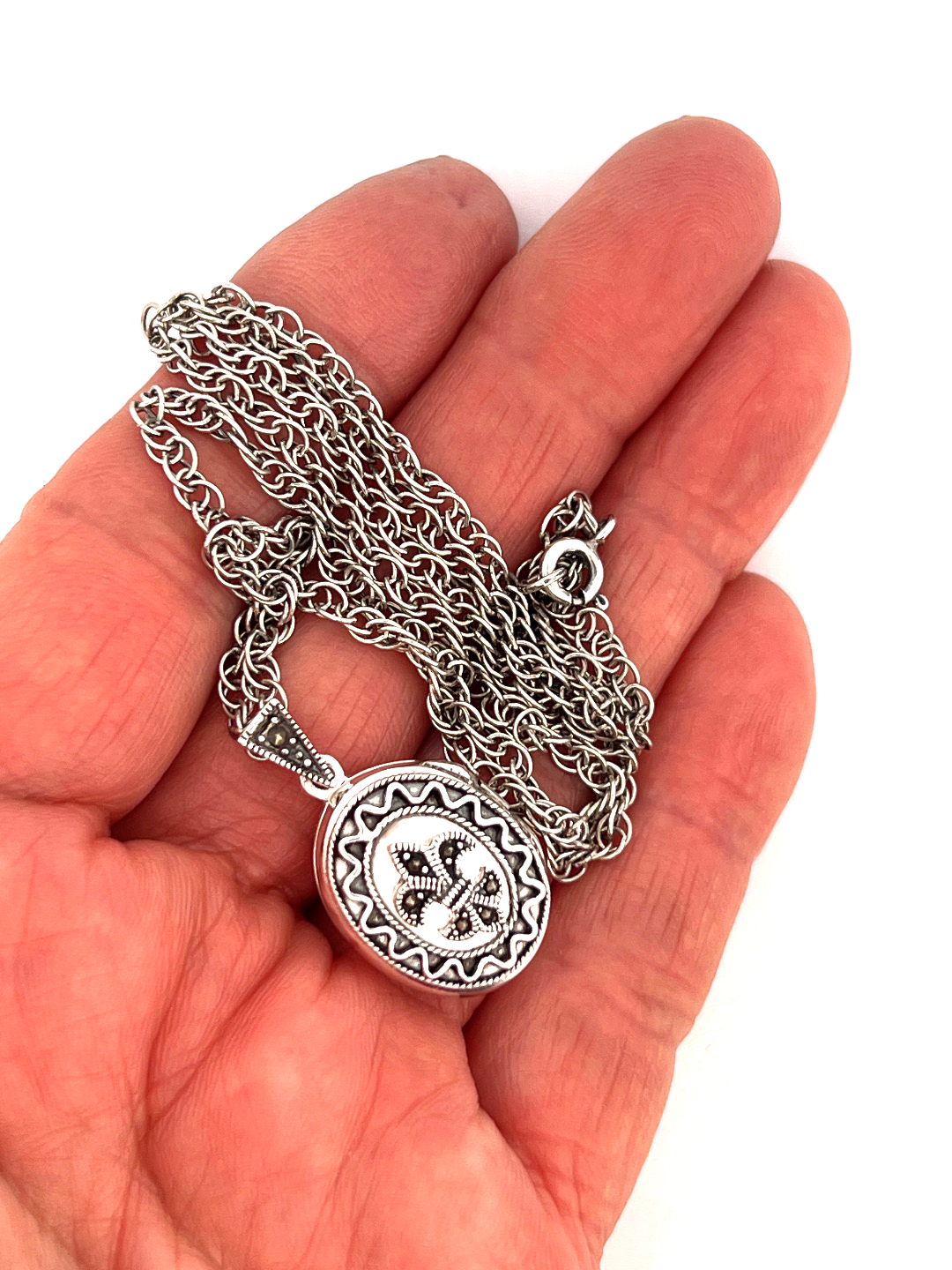 PT201 (4) Small Oval Fleur De Lys Locket Set with Marcasite on Rope Chain, finished in 925 English Hallmarked Sterling Silver