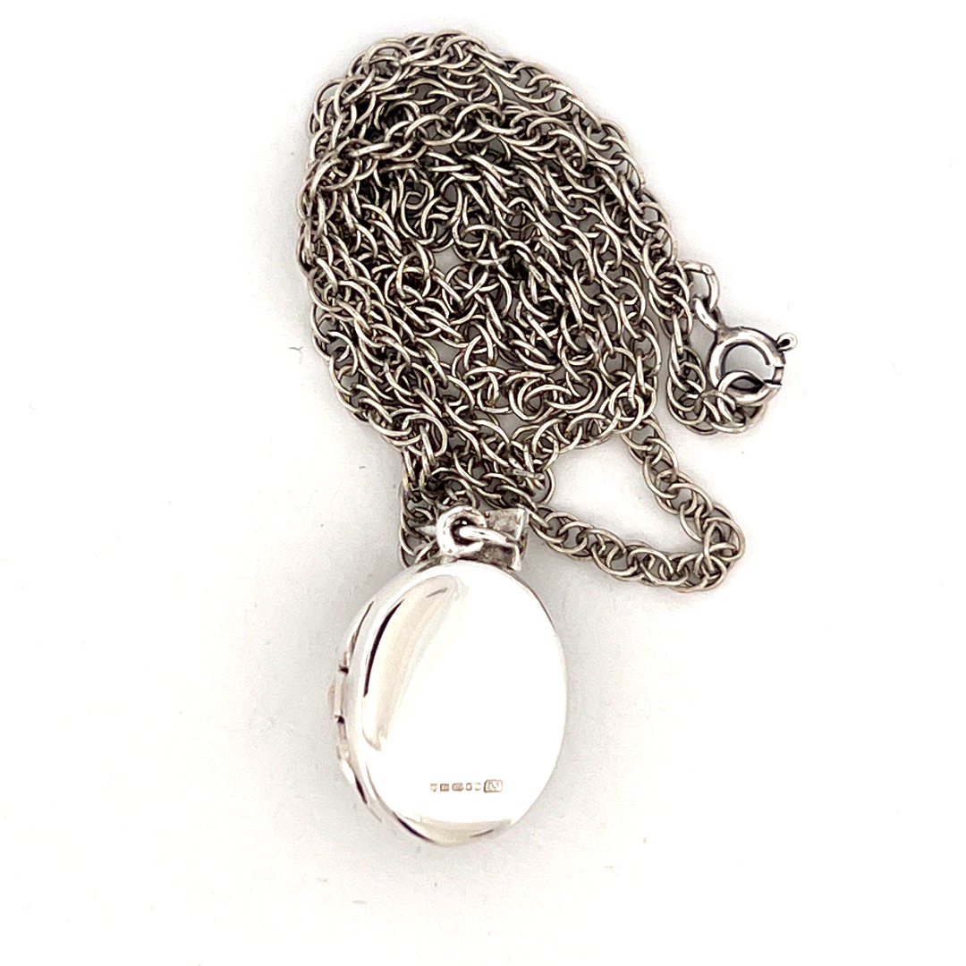 PT201 (7) Small Oval Fleur De Lys Locket Set with Marcasite on Rope Chain, finished in 925 English Hallmarked Sterling Silver