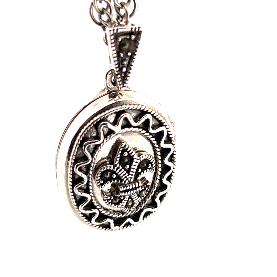 PT201 (9) Small Oval Fleur De Lys Locket Set with Marcasite on Rope Chain, finished in 925 English Hallmarked Sterling Silver
