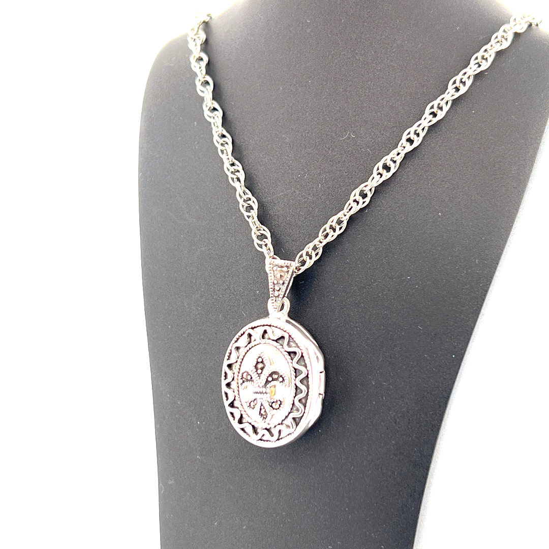 PT201 (8) Small Oval Fleur De Lys Locket Set with Marcasite on Rope Chain, finished in 925 English Hallmarked Sterling Silver