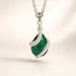 Sterling Silver Snake Wrapped Green Enamel Egg Pendant