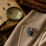 Sterling silver spider brooch with enamel, marcasite and crystals.