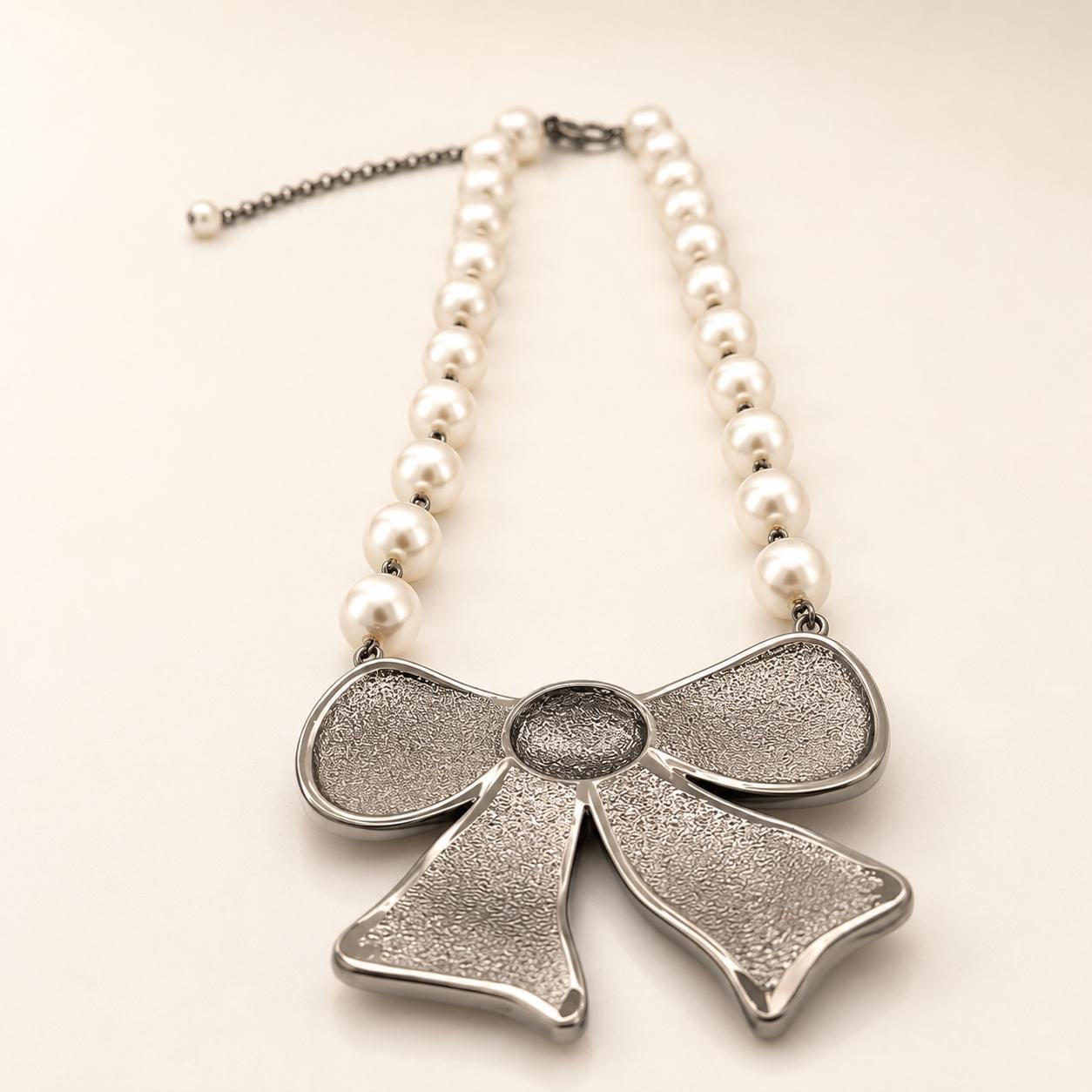il-fullxfull.8084546235-2d6l-il-fullxfull.8084546235-2d6l.jpg Swarovski Crystal and Pearl Black Rhodium Bow Necklace